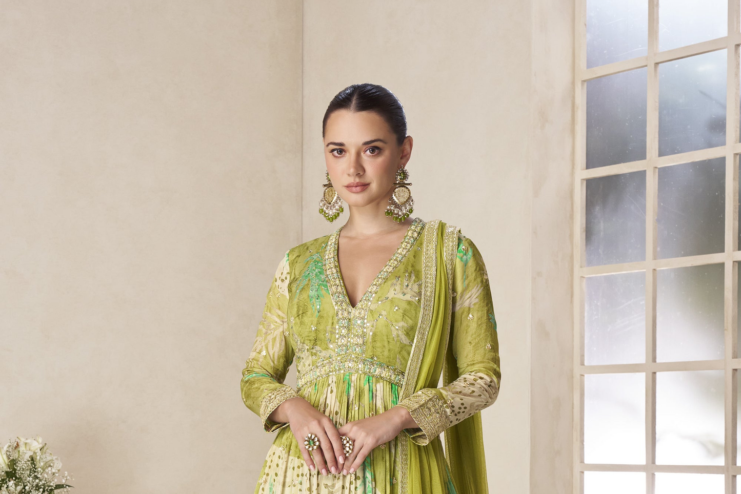 Elegant pistachio green anarkali gown with net dupatta drape