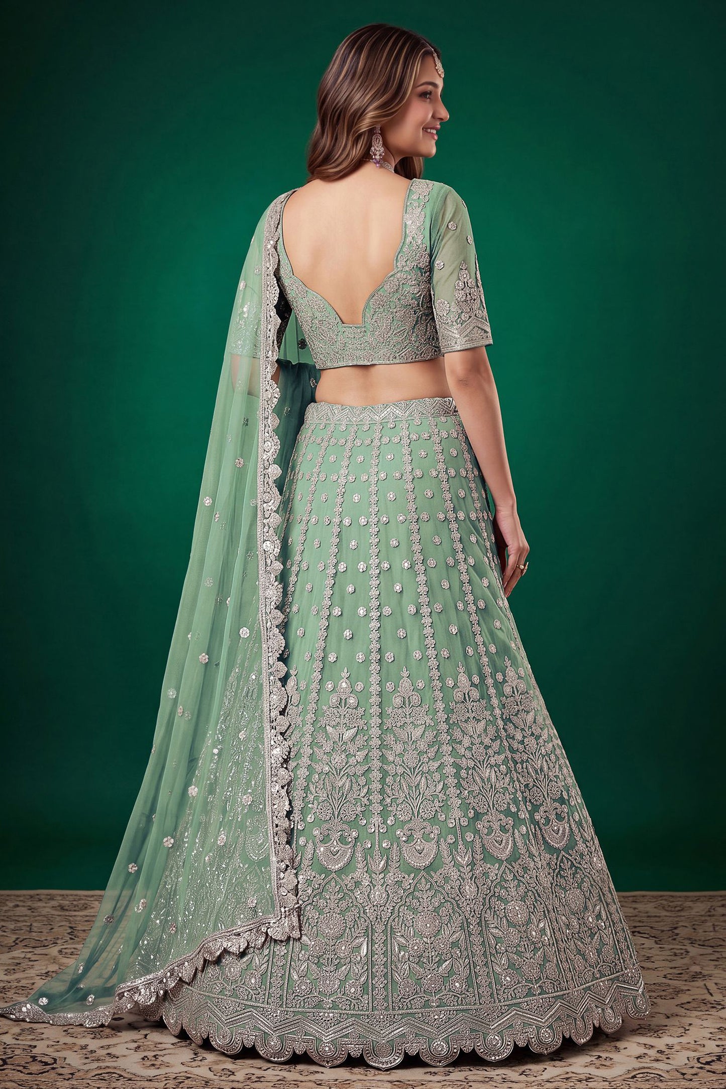 Back view of pistachio green lehenga choli with embroidery