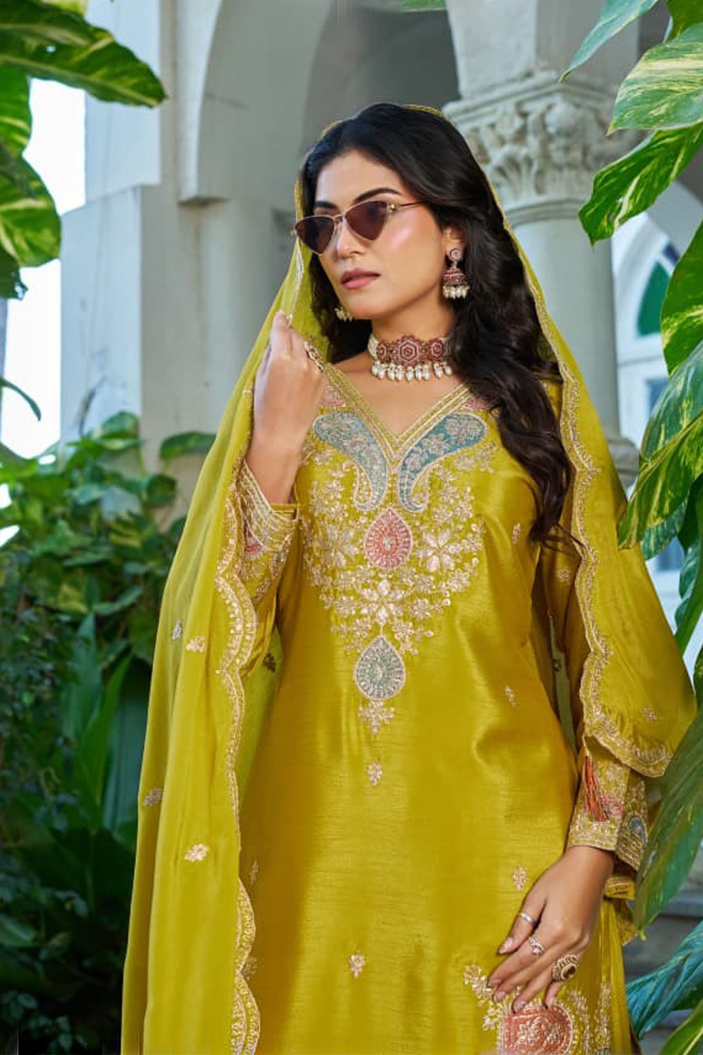Woman wearing mustard yellow palazzo outfit with sequence work