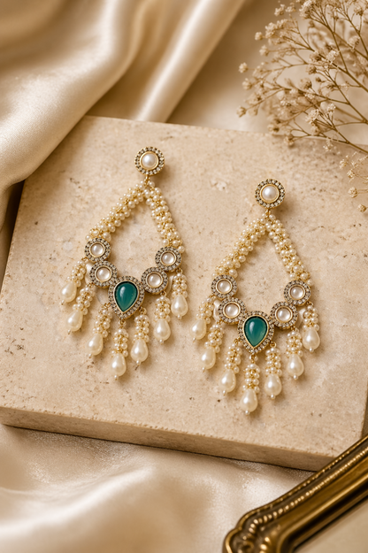 elegant gold earrings with pearl beads and stone centerpiece