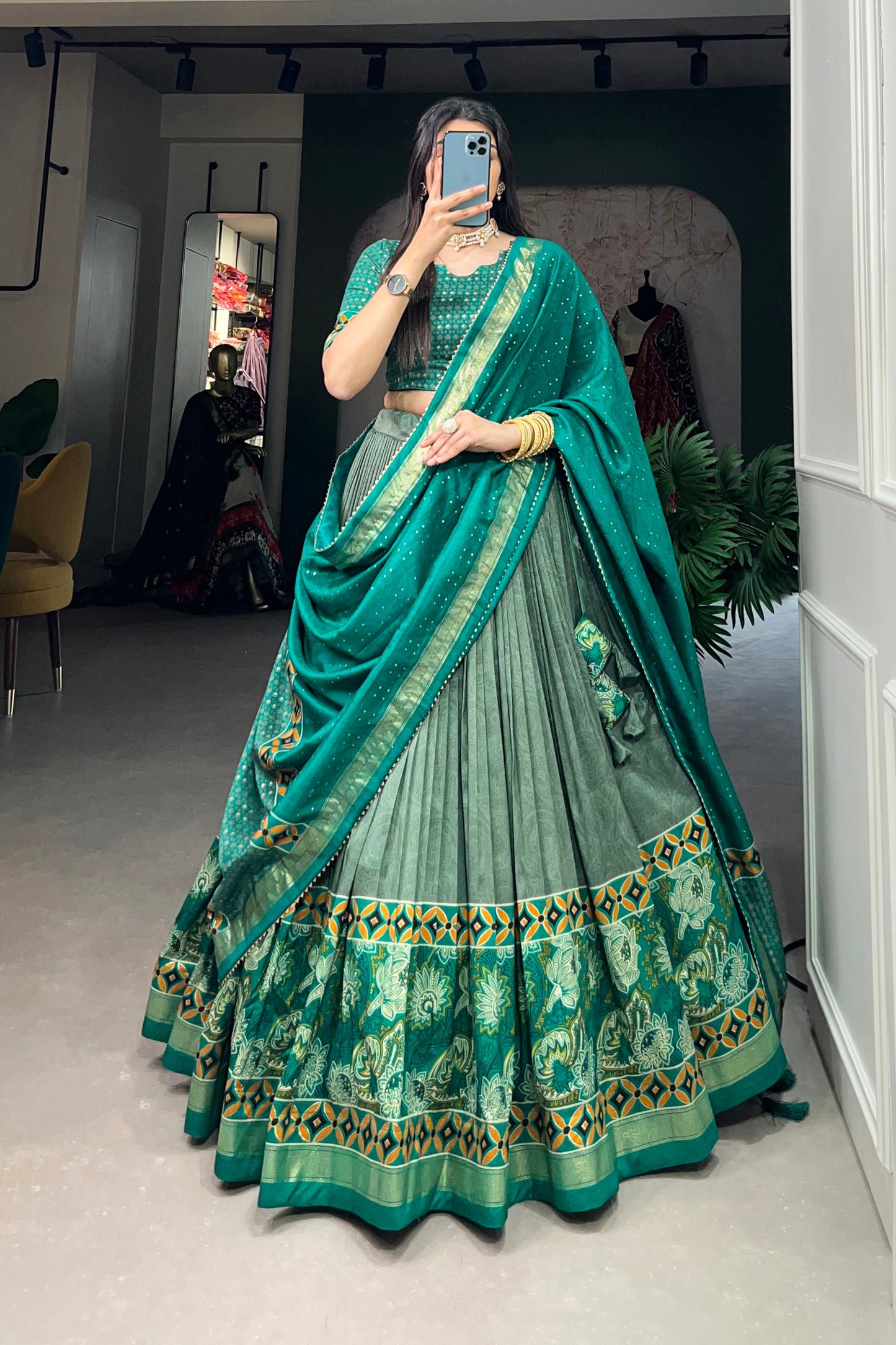Model wearing green lehenga at evening celebration