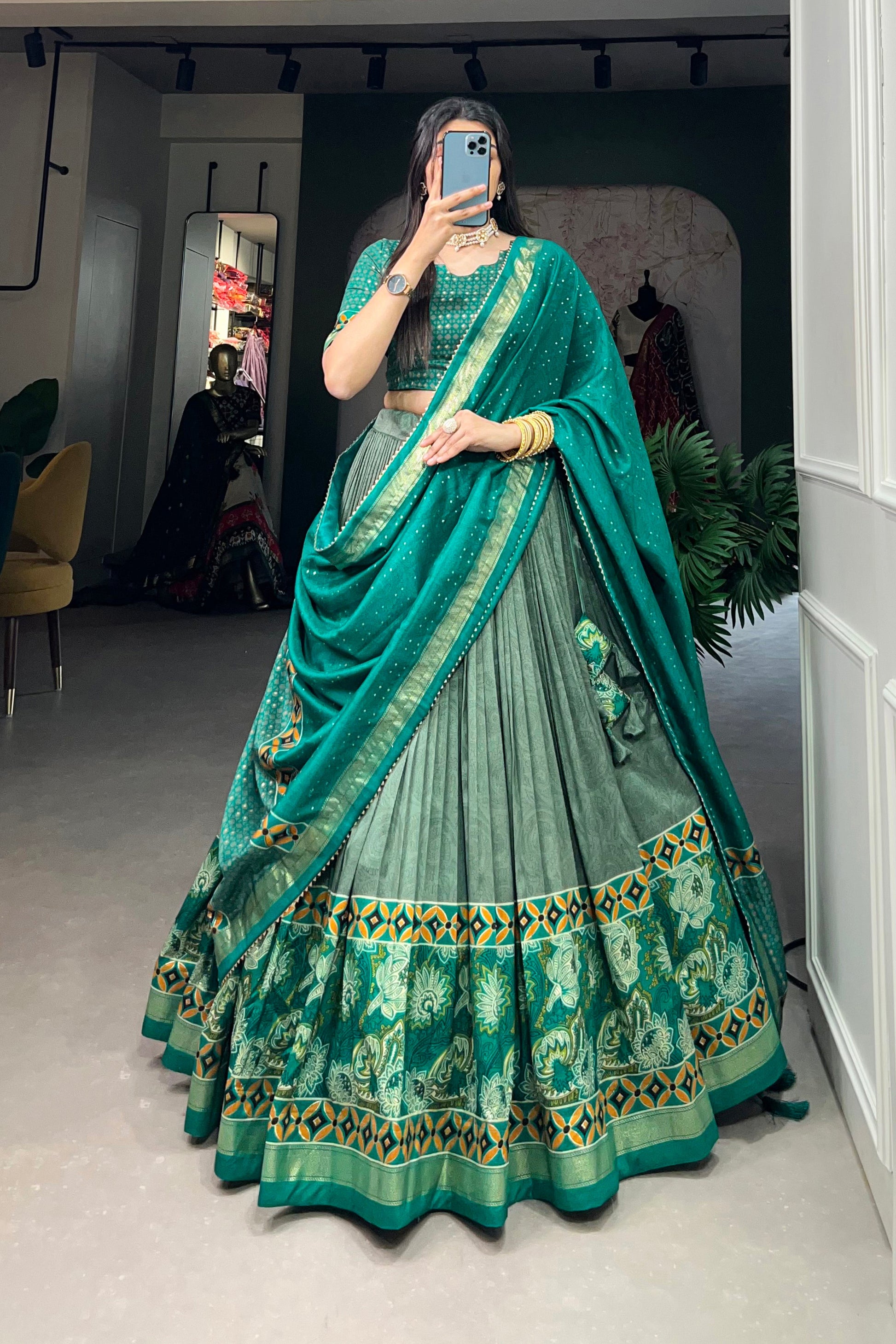 Model wearing green lehenga at evening celebration