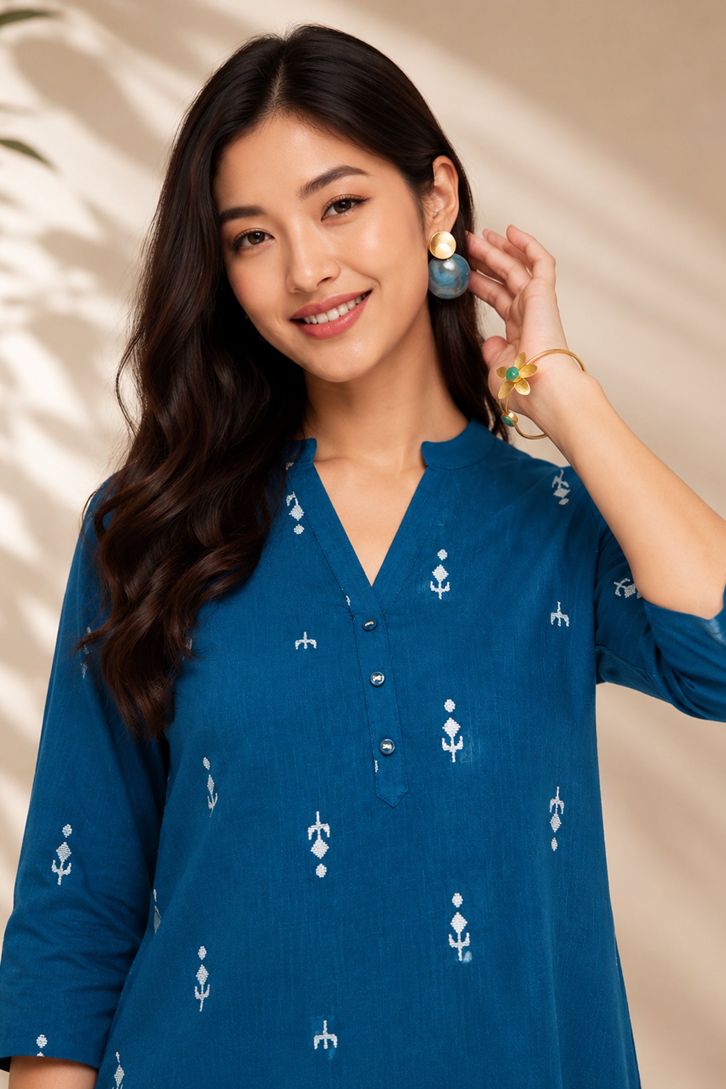 Front view of teal cotton tunic with printed detail