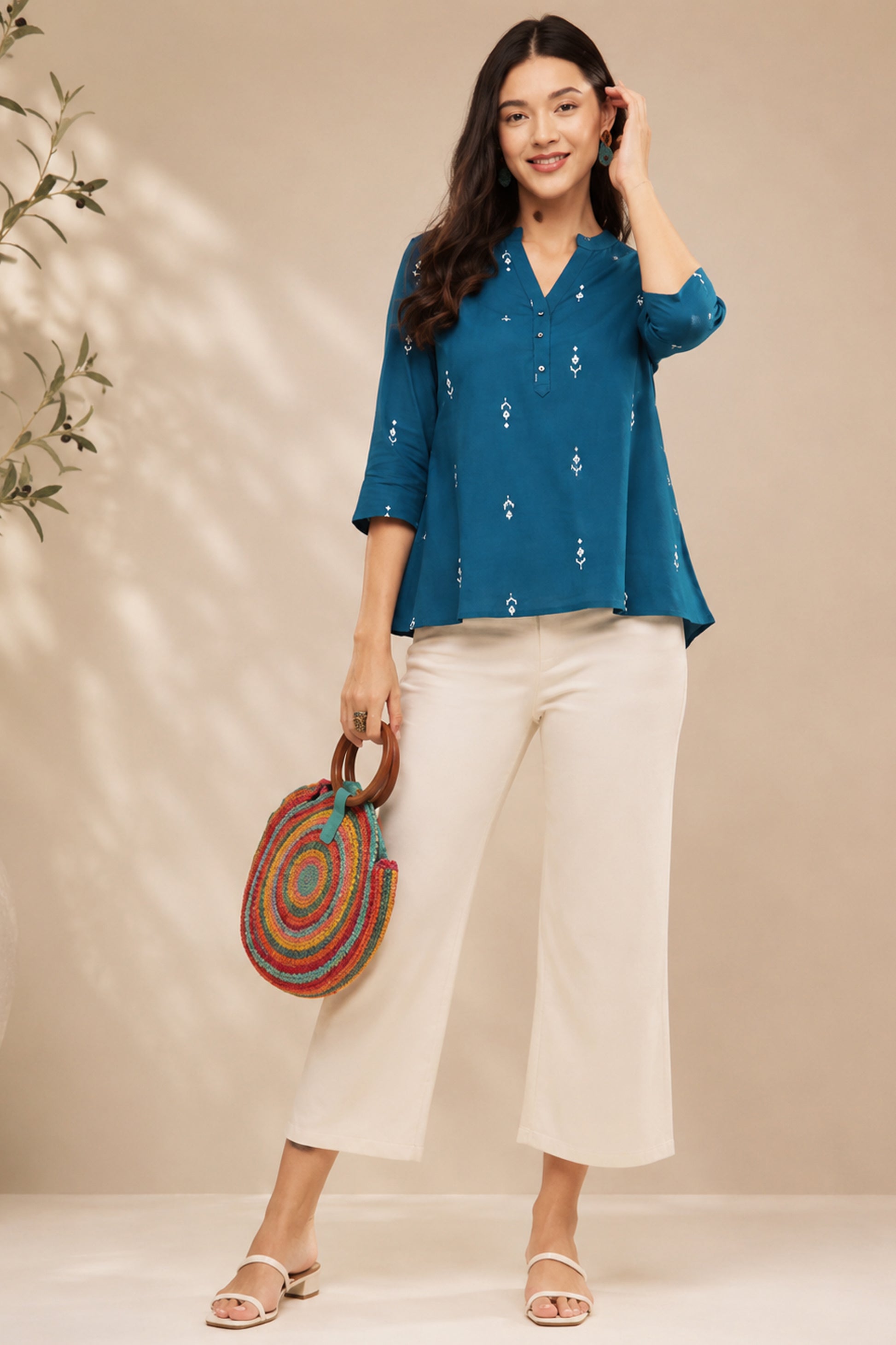 Casual teal tunic with soft printed surface