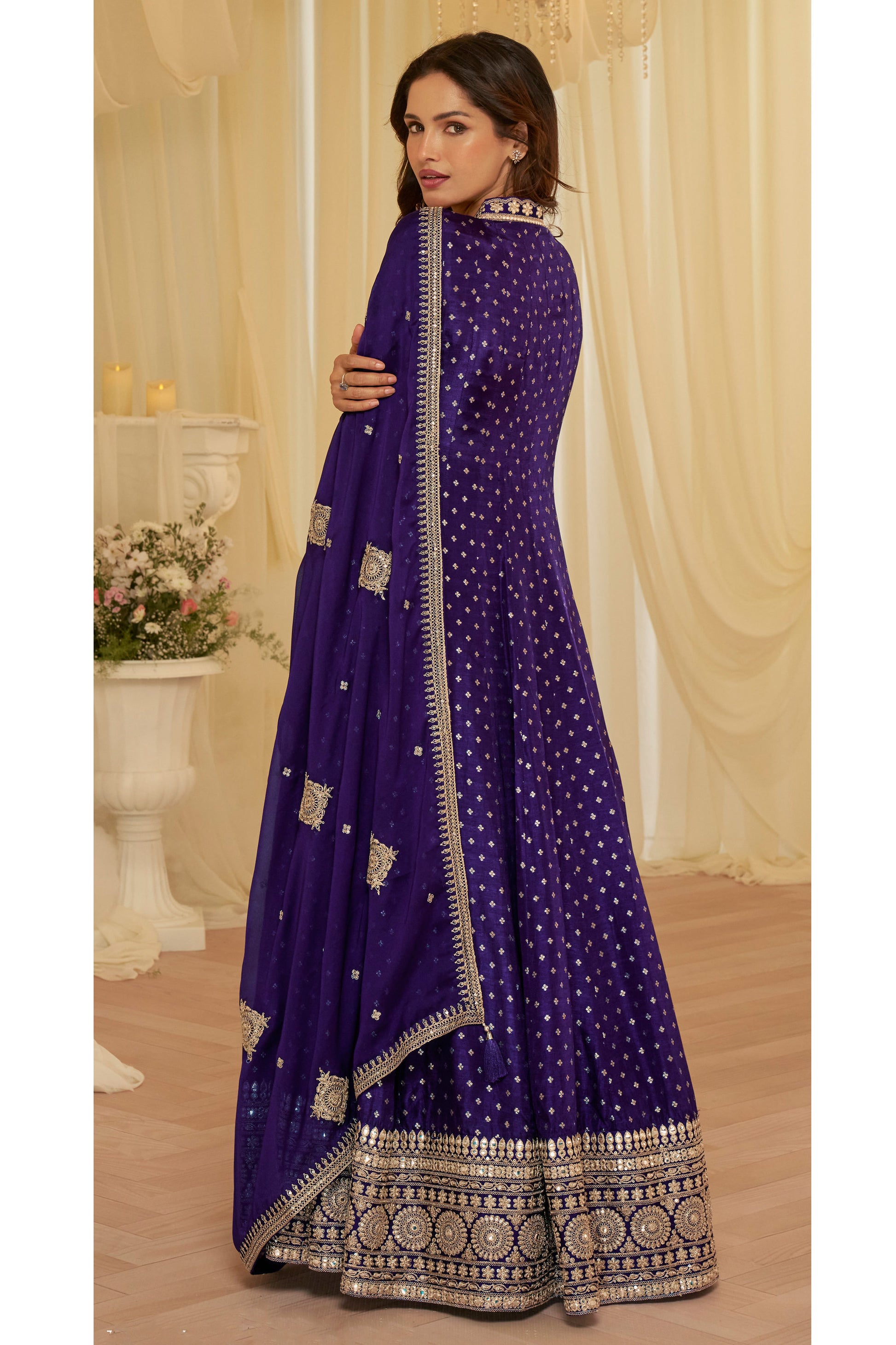 Close-up of heavy embroidery on purple jacquard silk