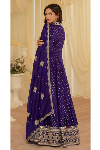 Close-up of heavy embroidery on purple jacquard silk