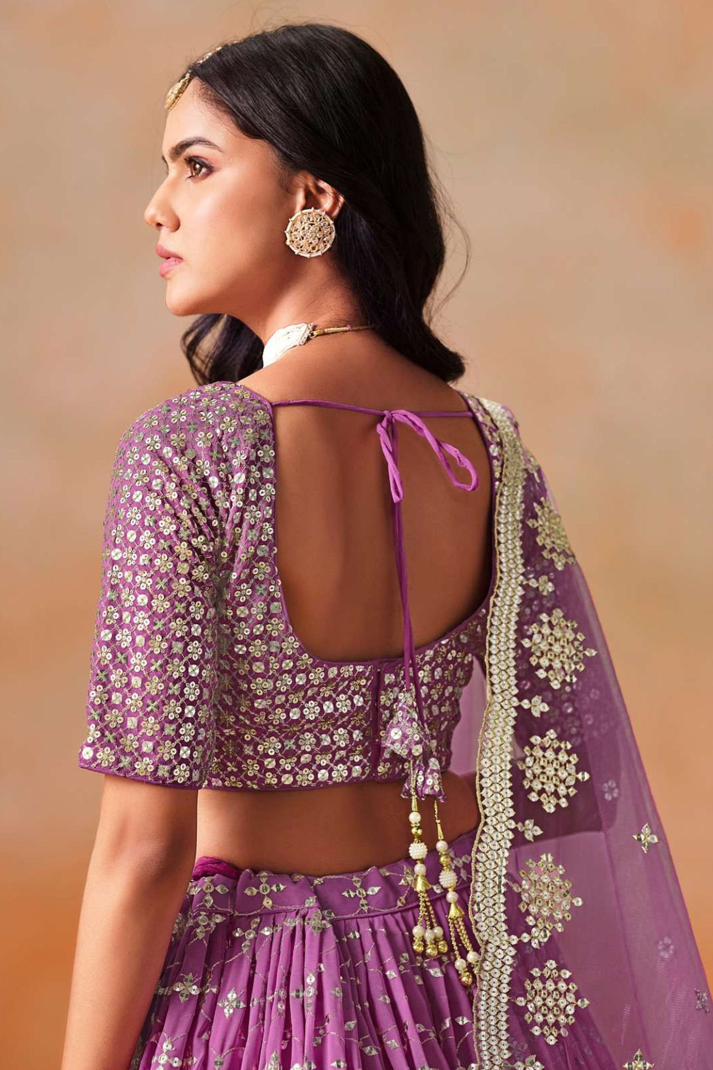 Reception-ready purple ghagra choli ensemble