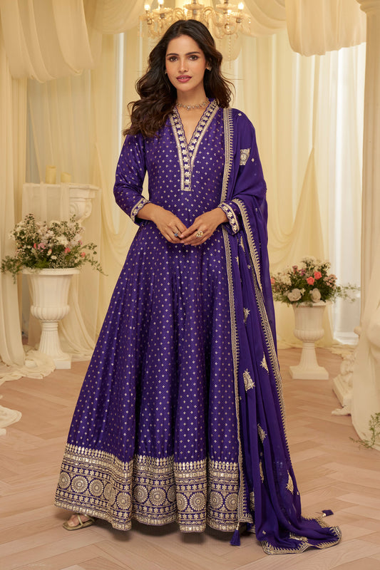 Front view of purple Indian anarkali gown with heavy embroidery
