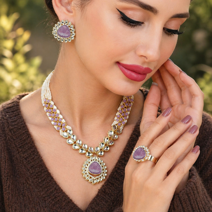 Model wearing purple kundan necklace set with matching earrings