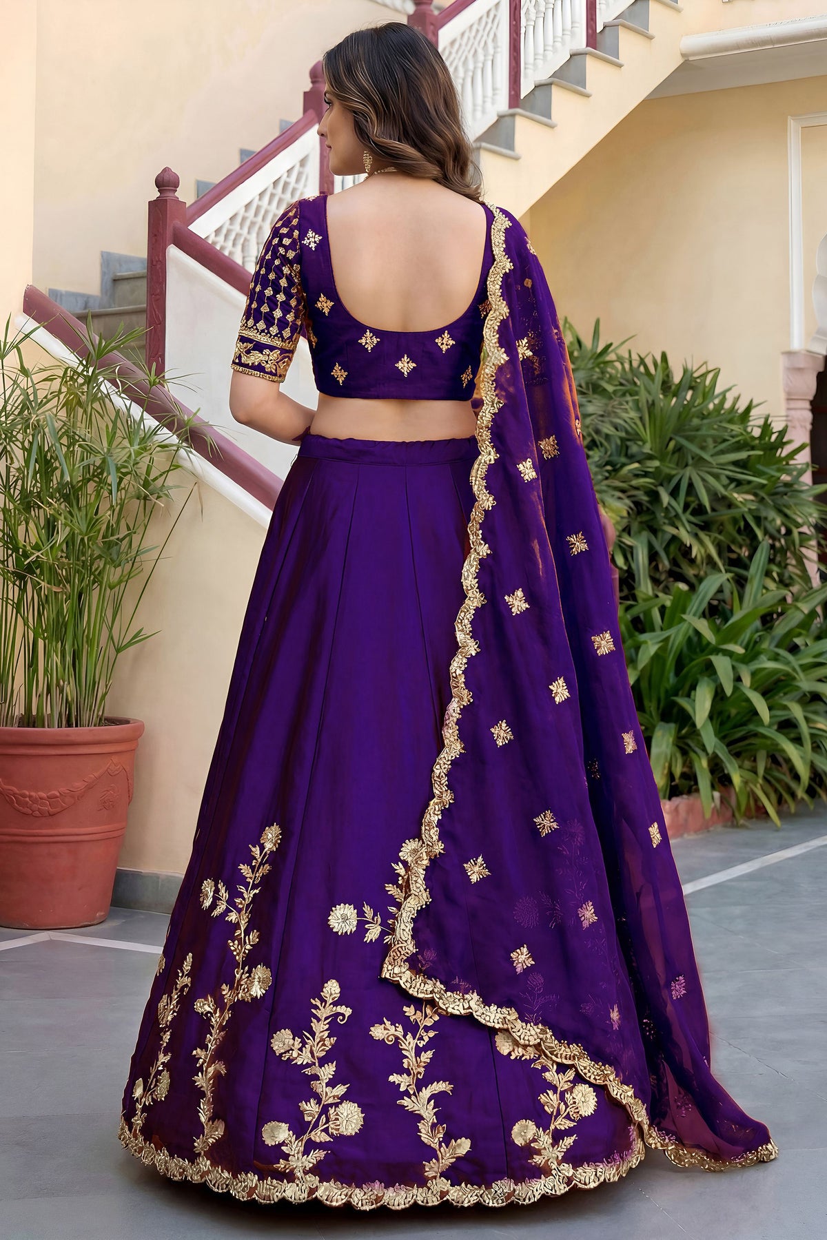 Purple lehenga choli back view showing dupatta drape