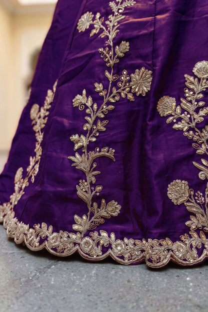Sequence work detail on purple lehenga hem