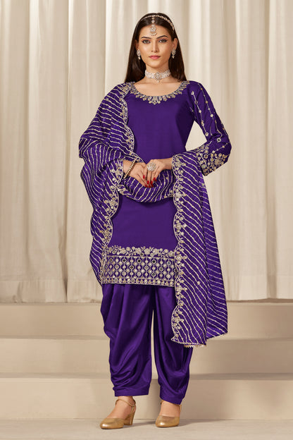 Front view of purple patiala salwar suit with embroidery and mirror work