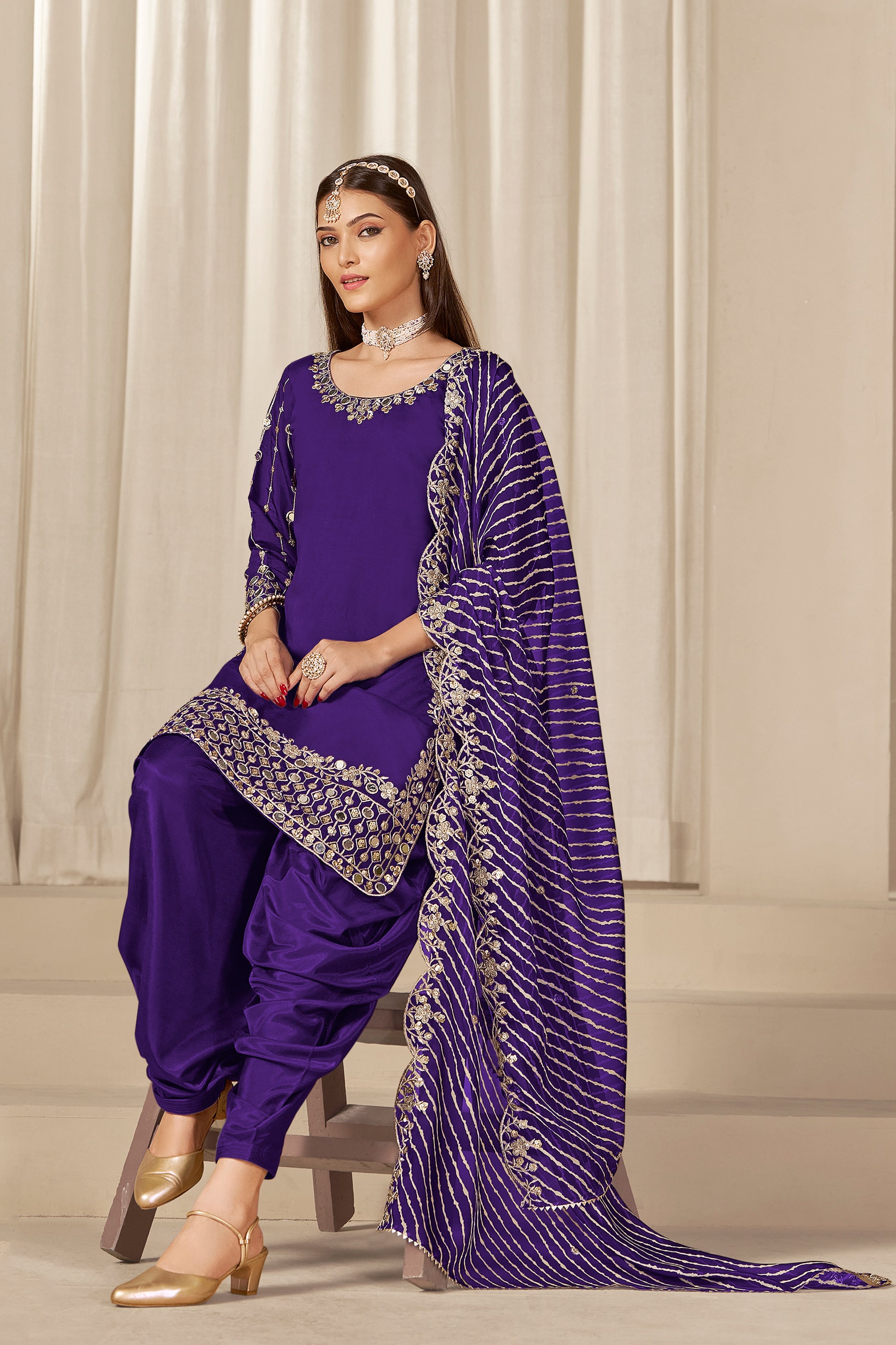 Side view of purple patiala suit with organza dupatta
