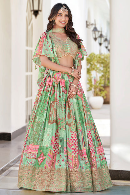 Lehenga choli designs in teal green with lace border detailing