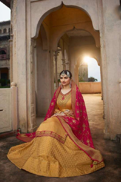 Elegant reception wear yellow indian lehenga choli inspired gown
