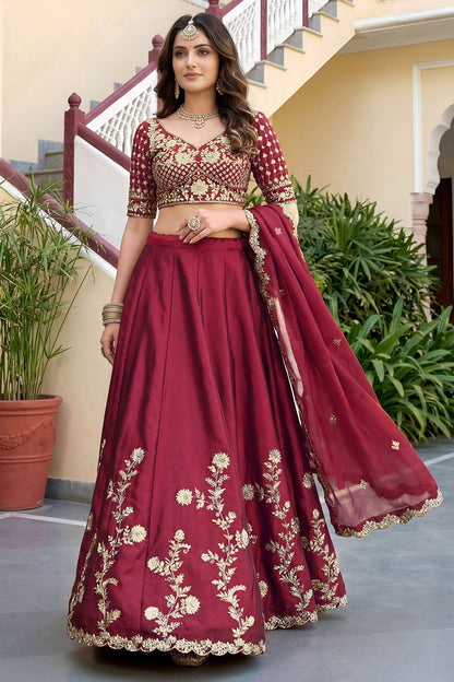 Red choli embroidery close-up with sequence work