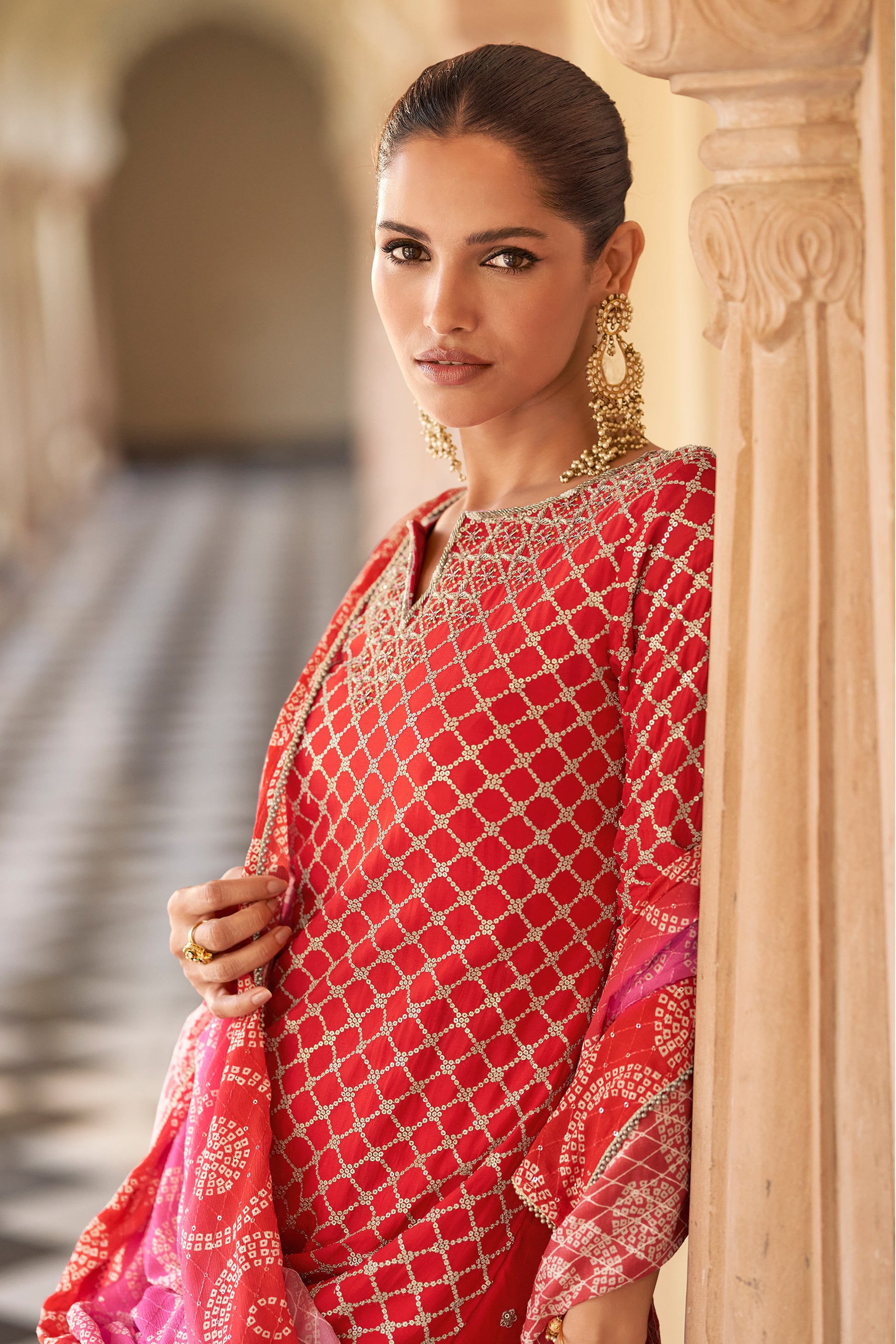 Red sharara suit kameez embroidery detail close-up