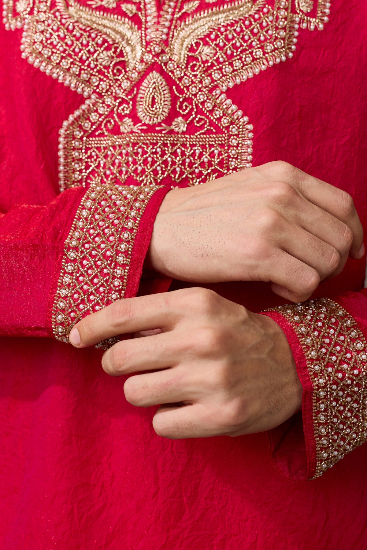 Red kurta sleeve detail with embroidery