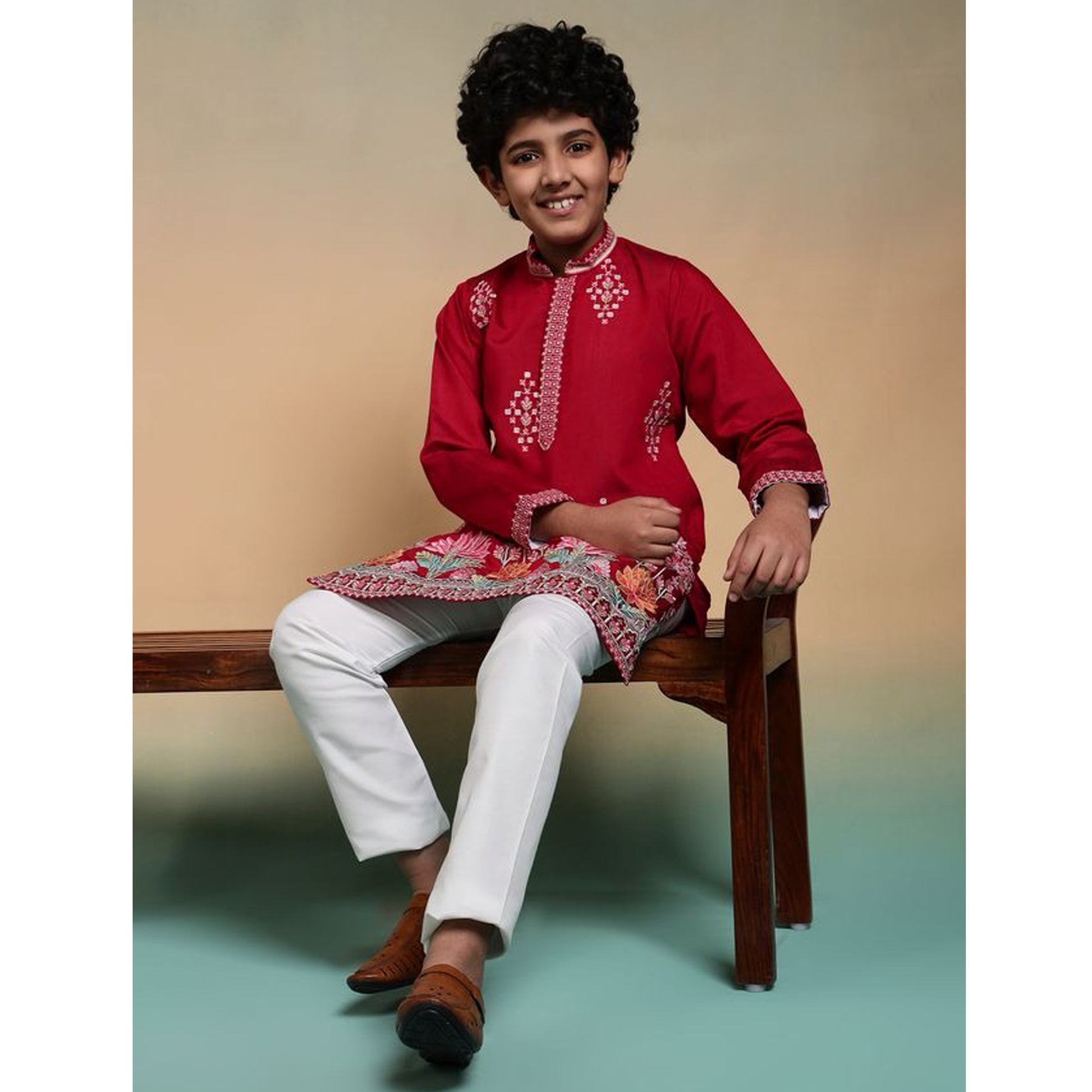 Full-length red kurta pant ensemble on model