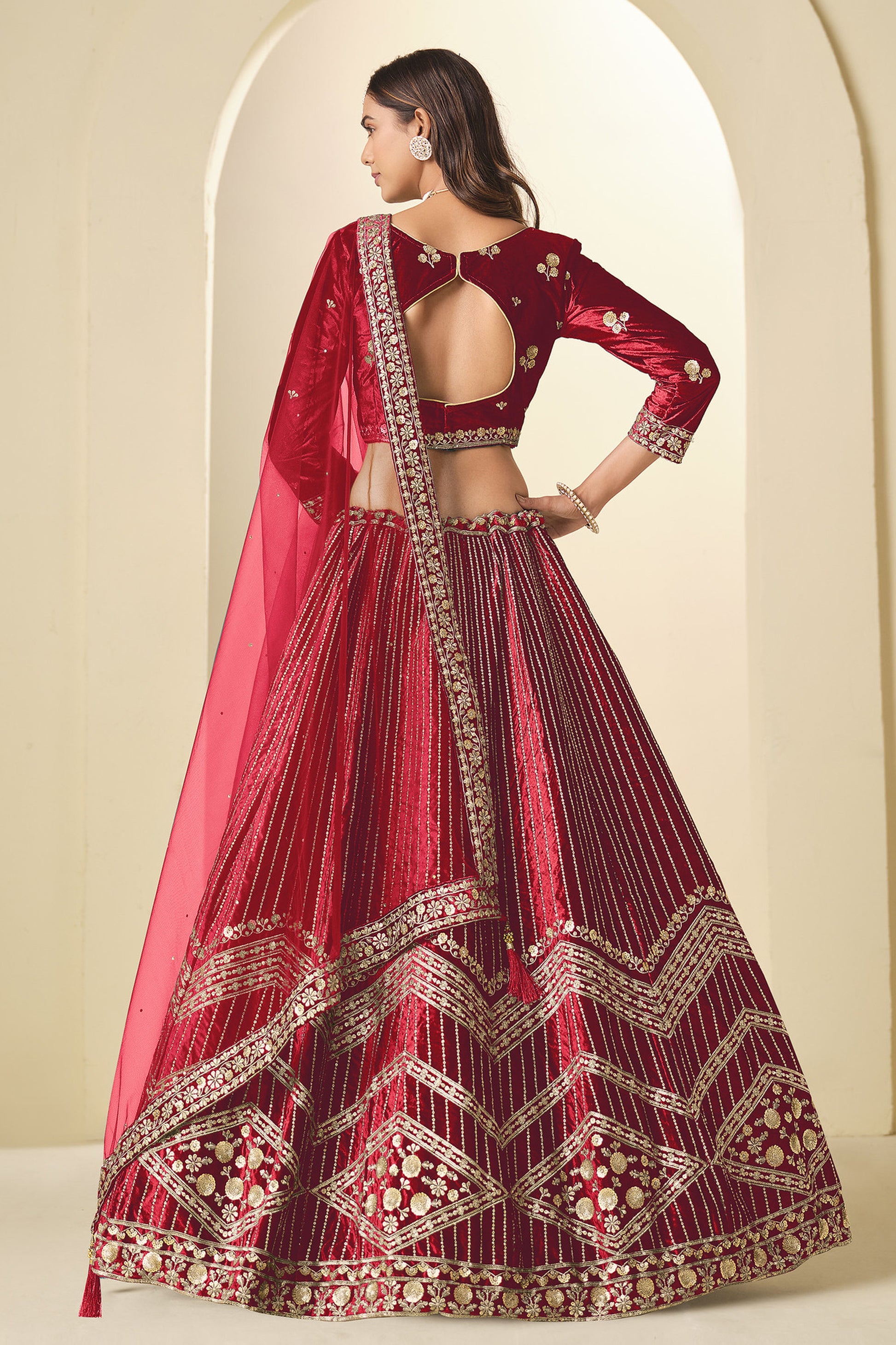 Model wearing Red Lehenga Choli with Heavy Sequins And Zari Embroidery