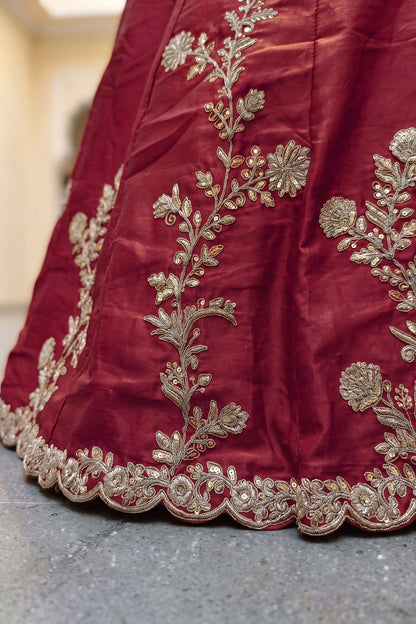 Zari dori and sequence embroidery close-up on red lehenga