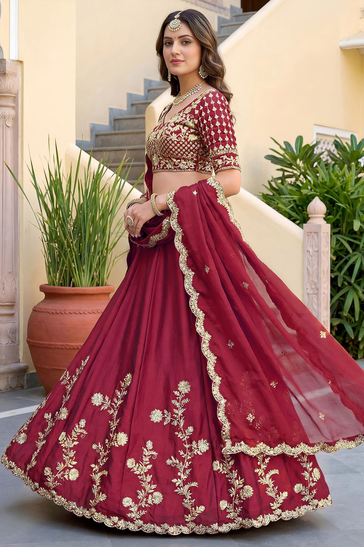 Red lehenga side view with embroidered choli
