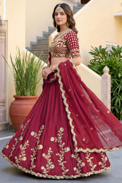 Red lehenga side view with embroidered choli
