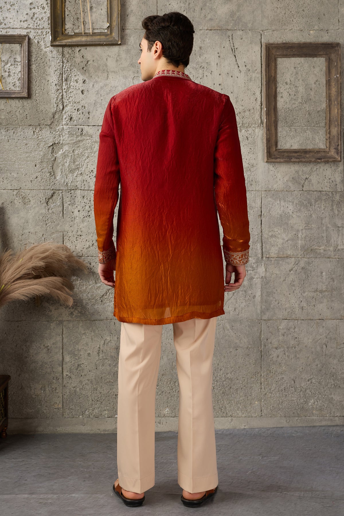 Front view of red embroidered men's kurta pajama set