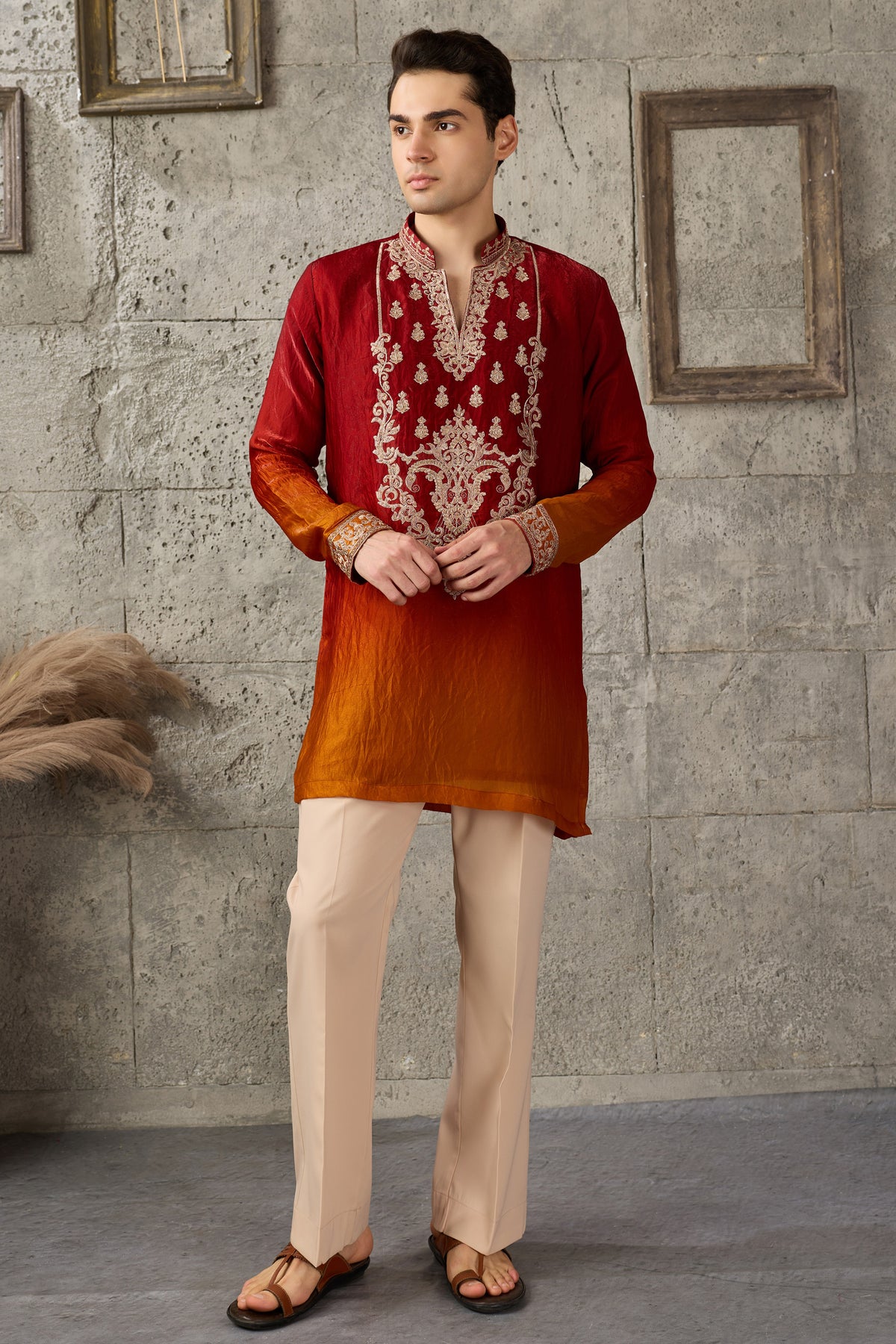 Detail of the embroidered neckline on a red kurta