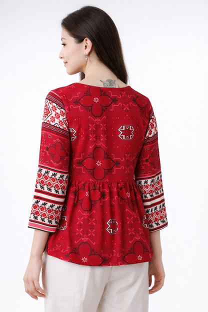back view of red tunic top with minimal detailing