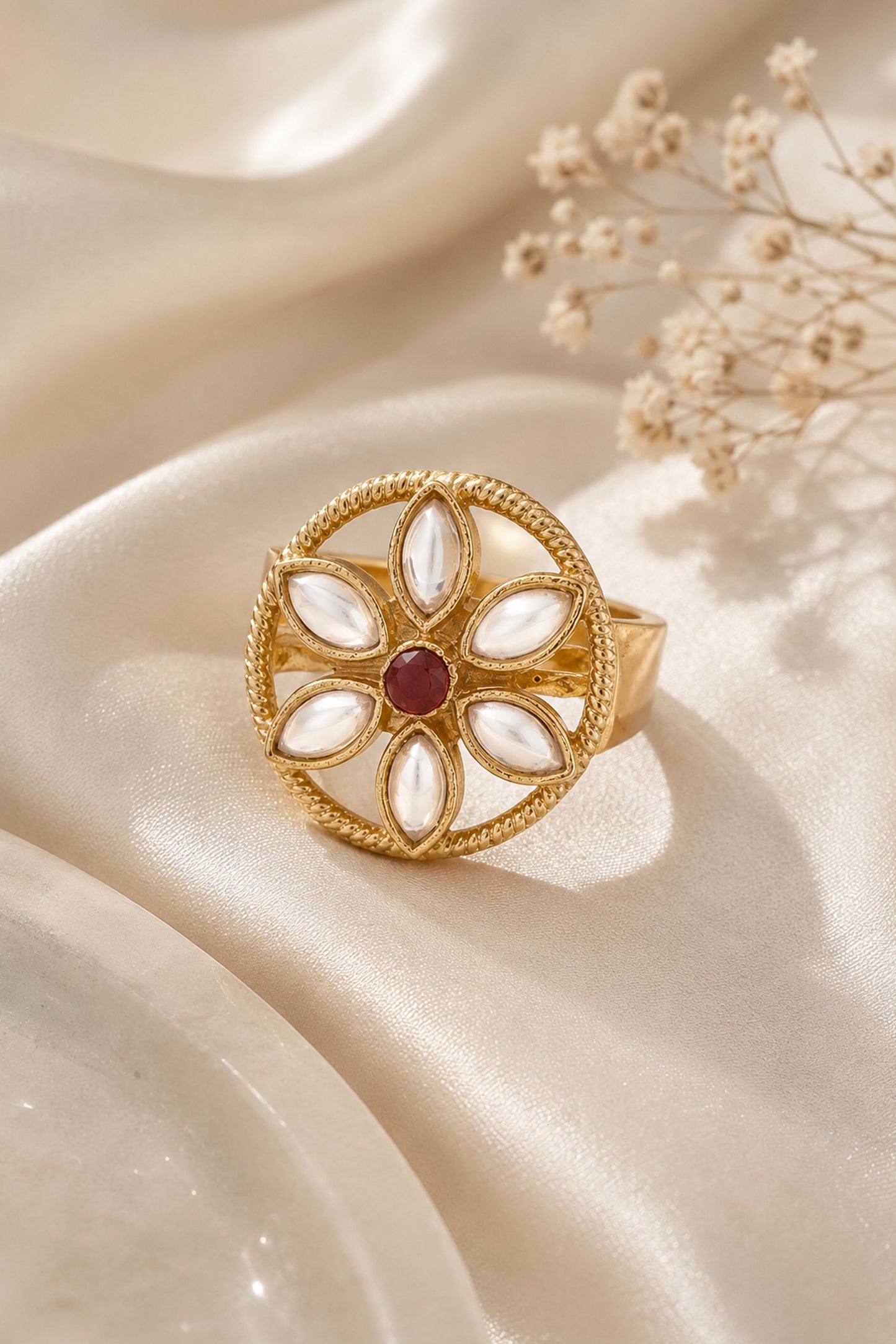Matching drop rings with framed red stones, clear accents and white petal details