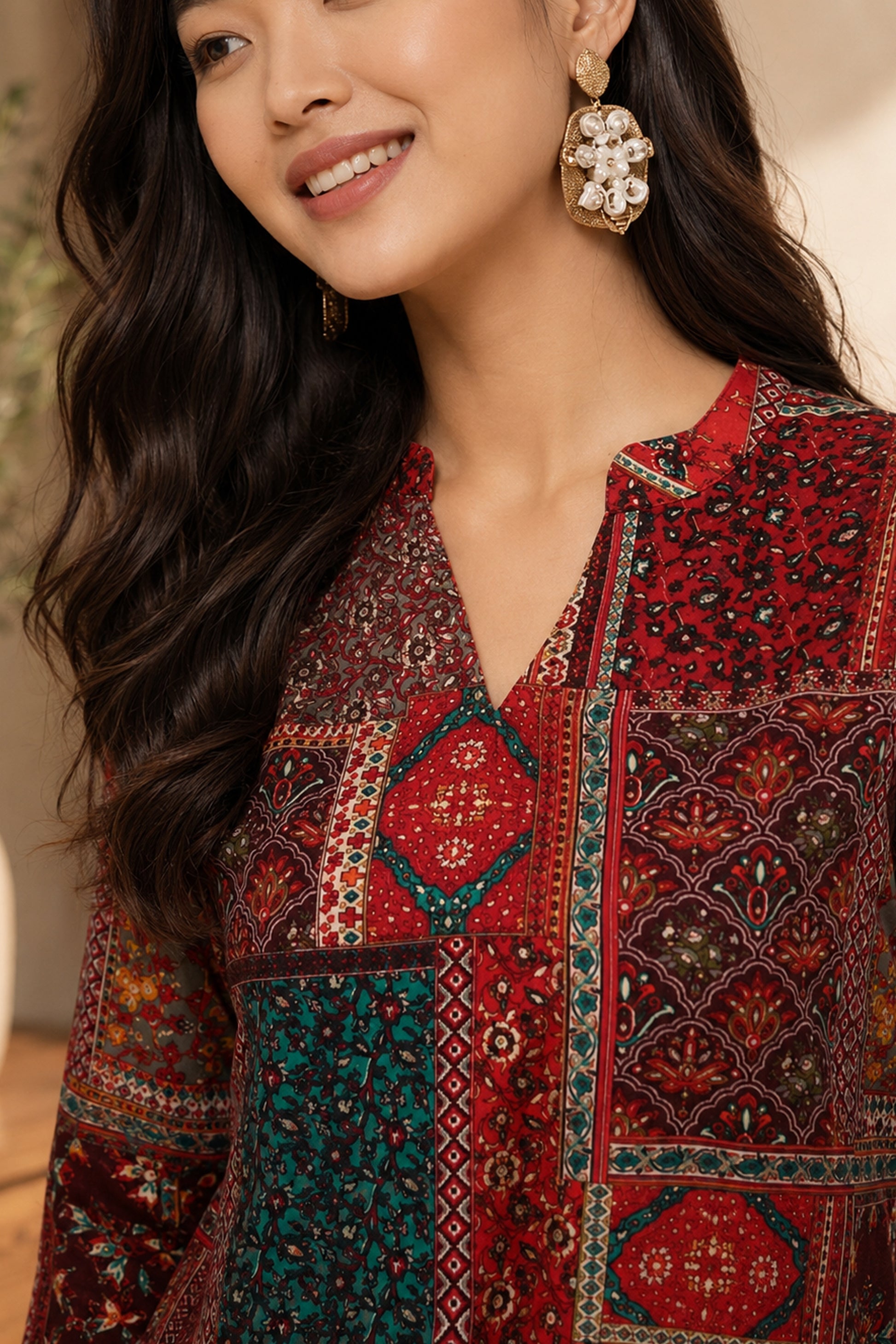 Casual maroon tunic paired with textured statement earrings