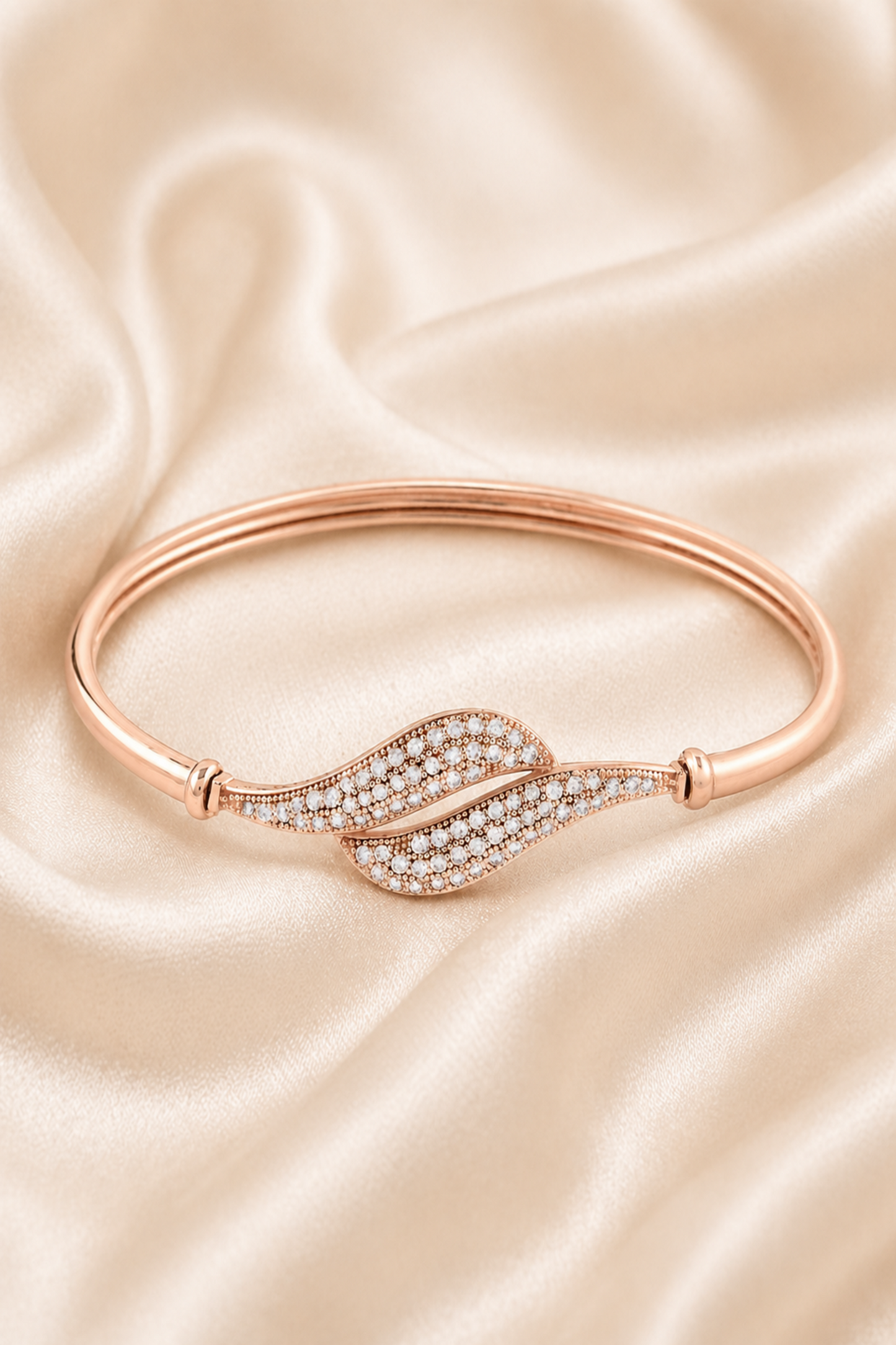 rose gold bracelet with leaf design and clear stones