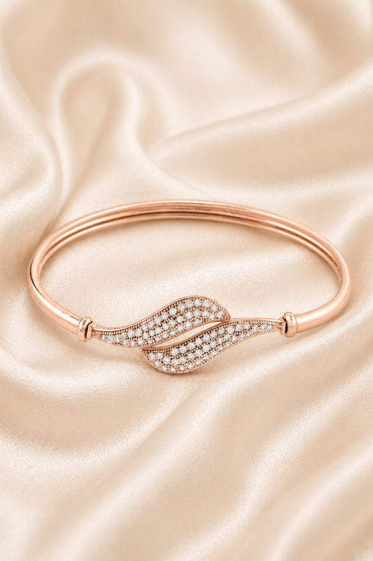 rose gold bracelet with leaf design and clear stones