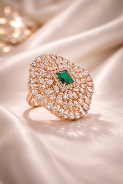 rose gold emerald ring worn on hand
