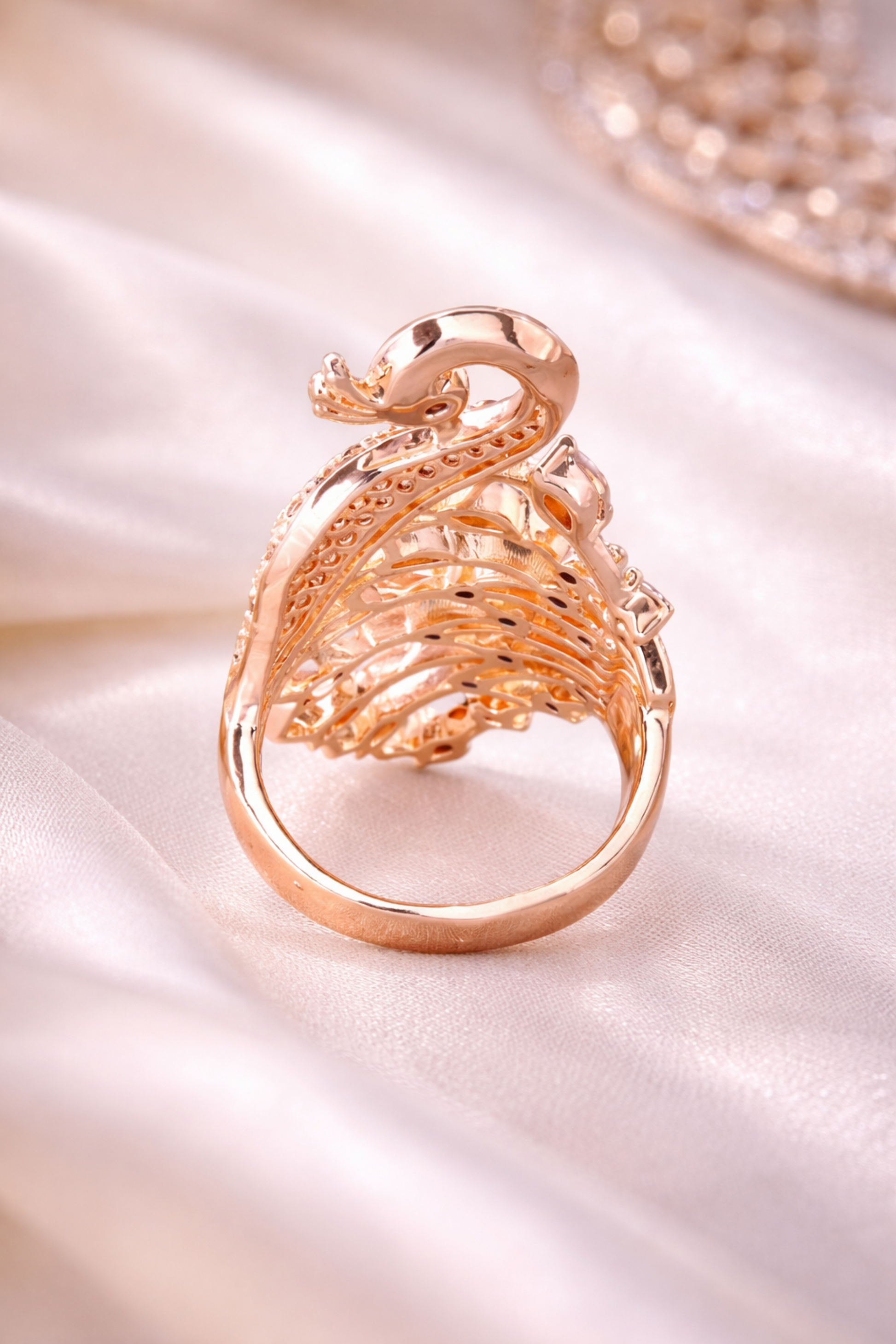 peacock feather inspired crystal ring detail
