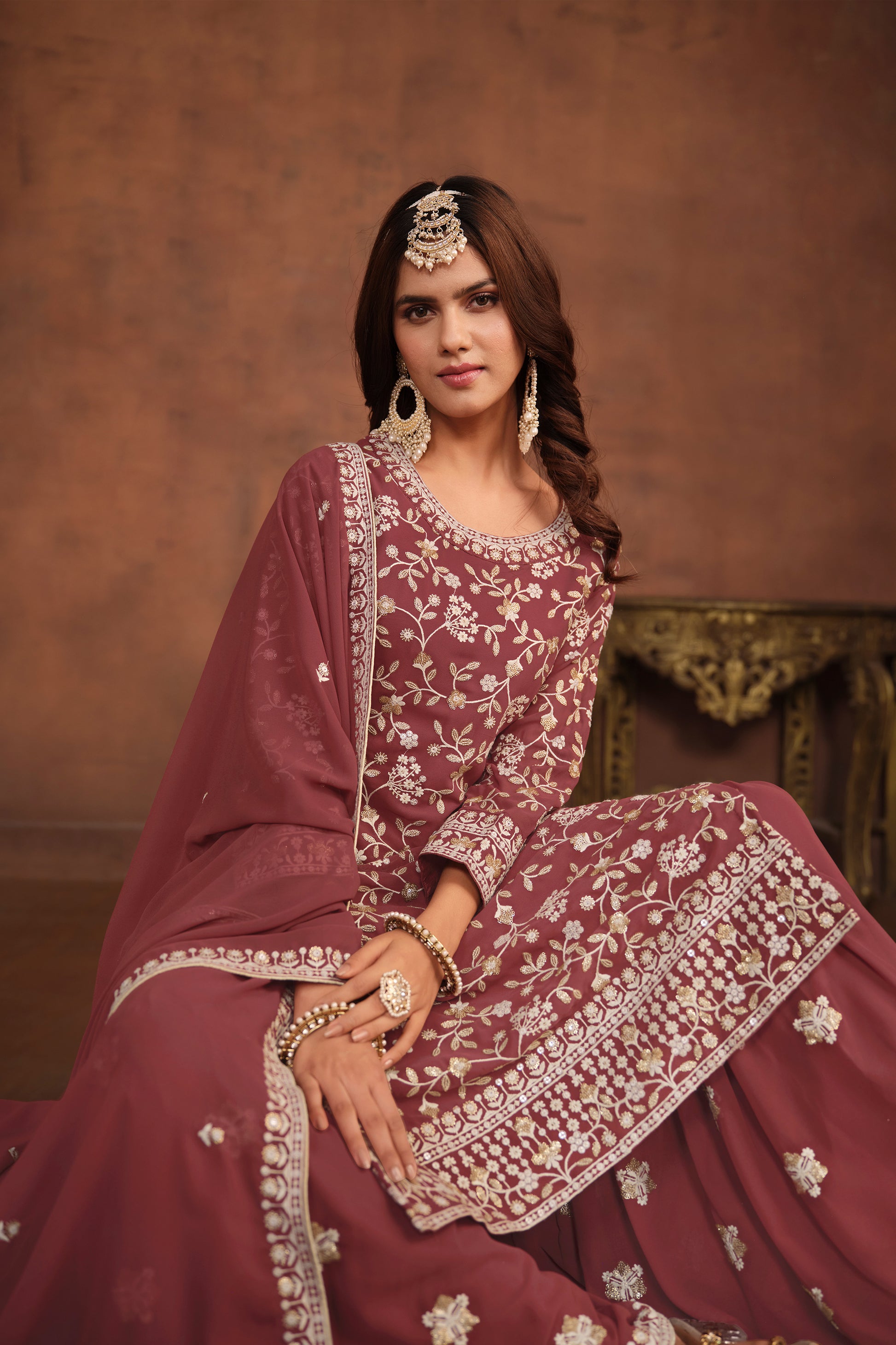 Close-up of embroidered kameez top in rose gold