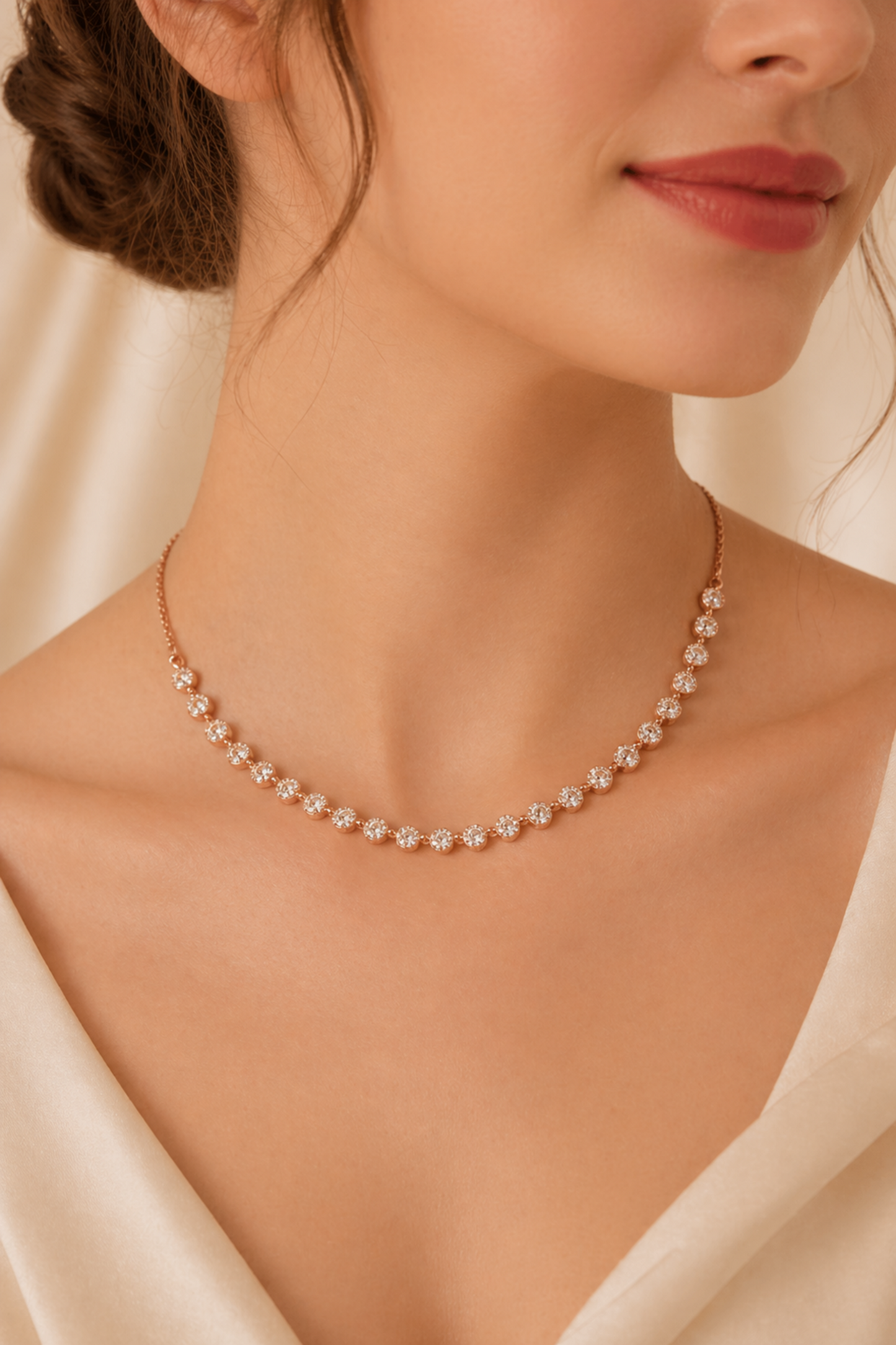 rose gold diamond necklace on silk background