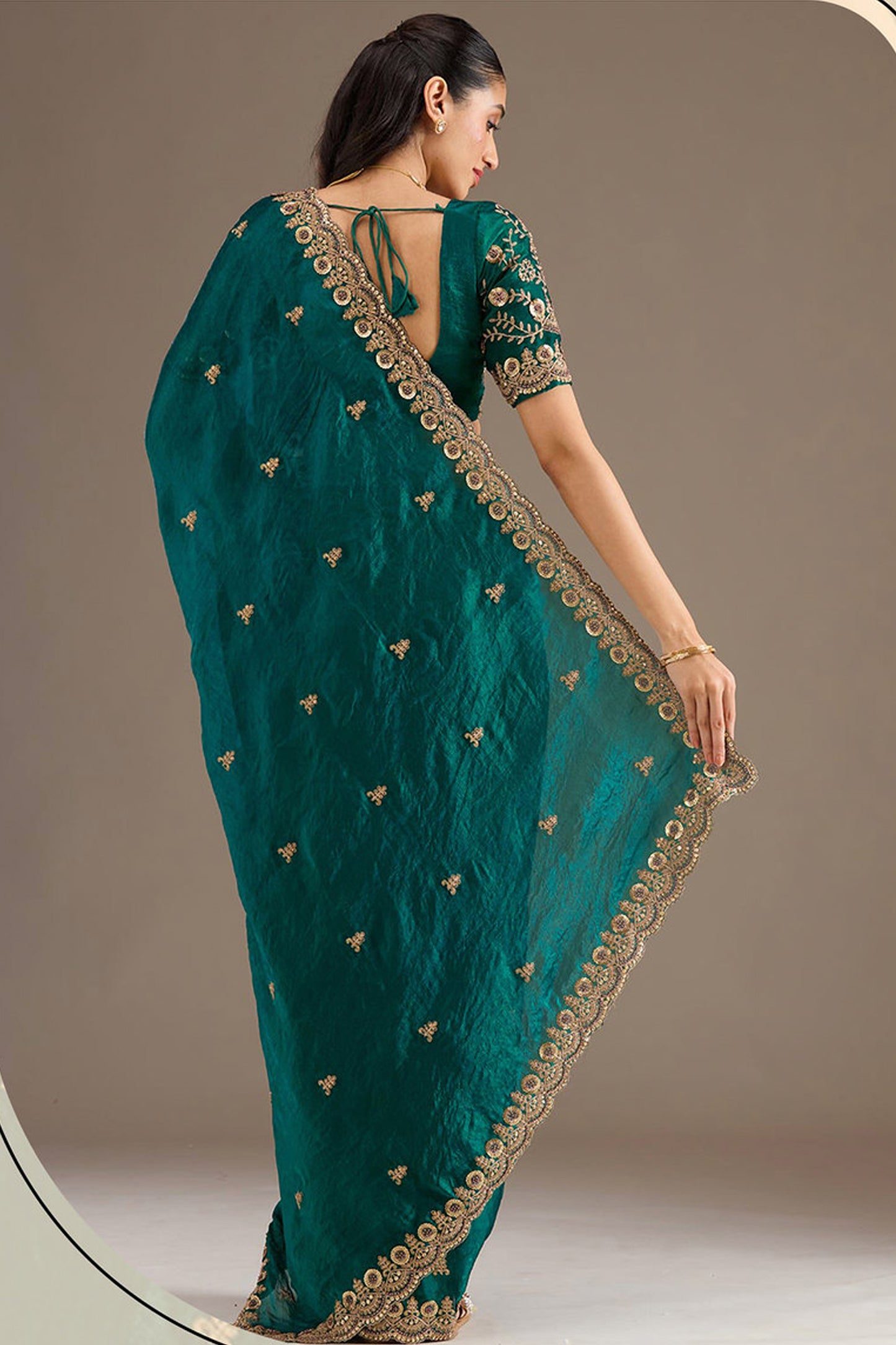 Royal green silk saree with detailed zari work