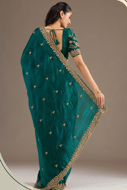 Royal green silk saree with detailed zari work