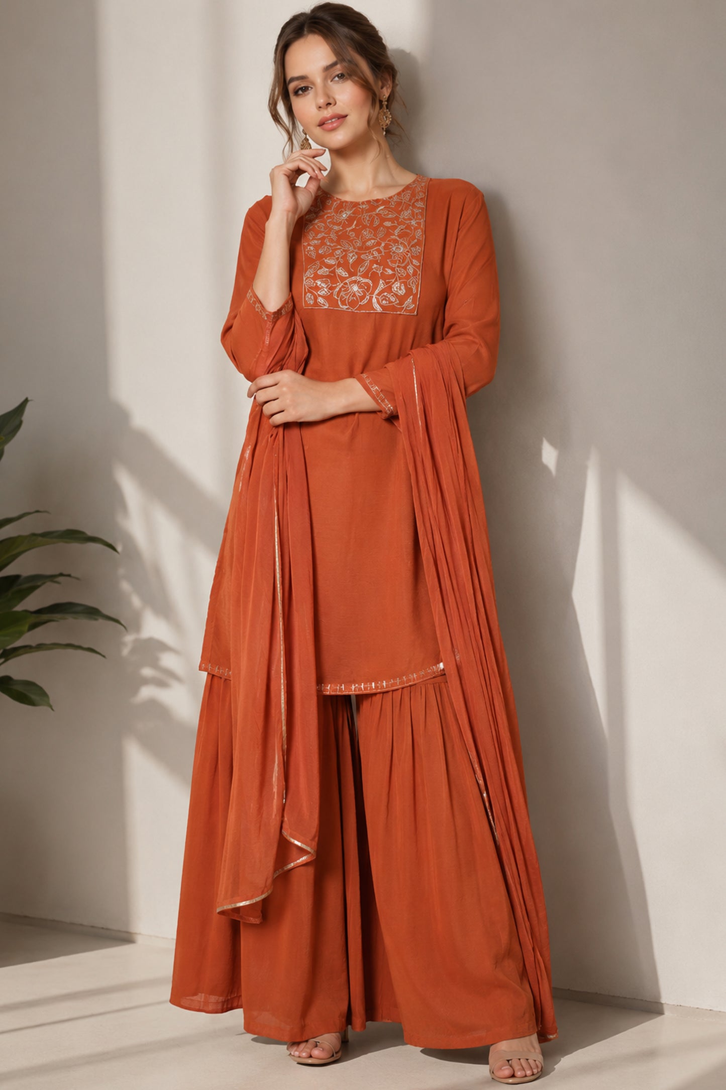 orange silk sharara shown in a full standing pose