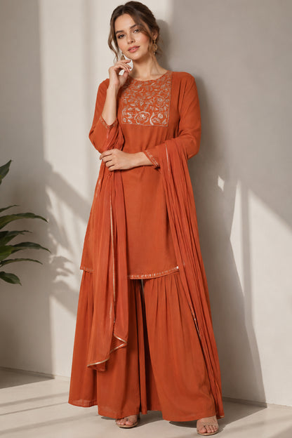 orange silk sharara shown in a full standing pose