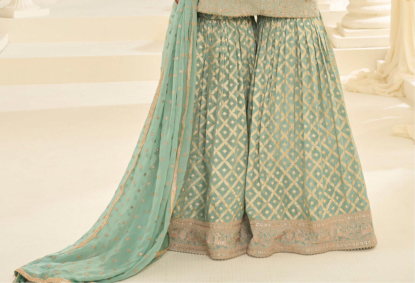 Sharara suit in sage green for wedding function look