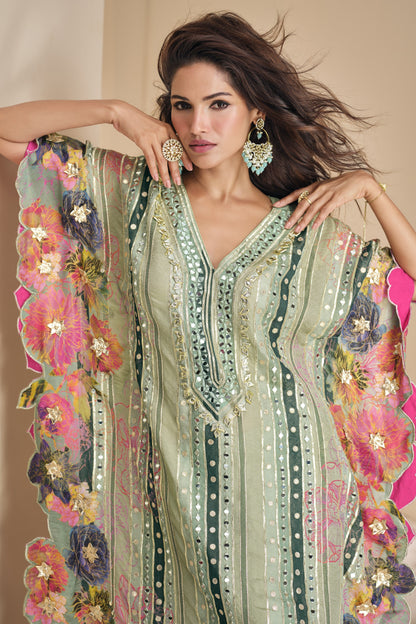 Sage green salwar suit with hand mirror work detailing