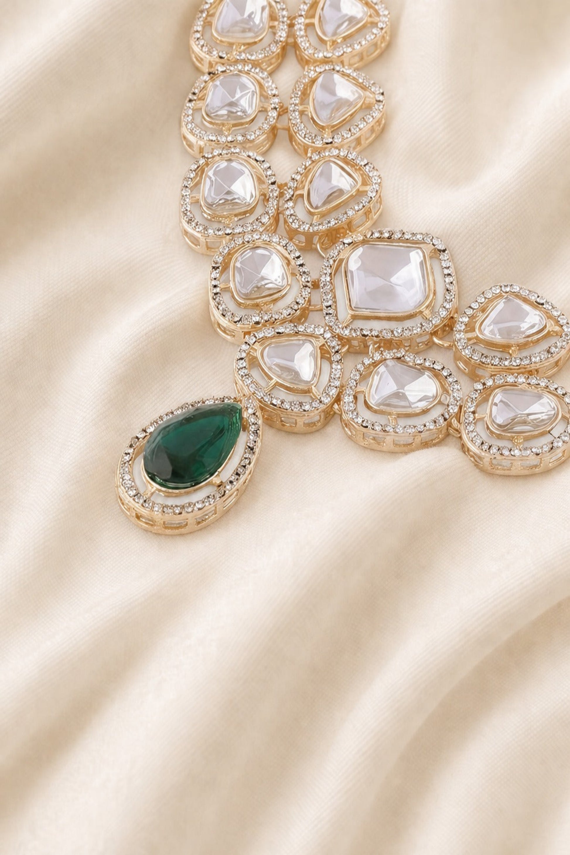 Close-up of layered necklace structure with polished stone detailing