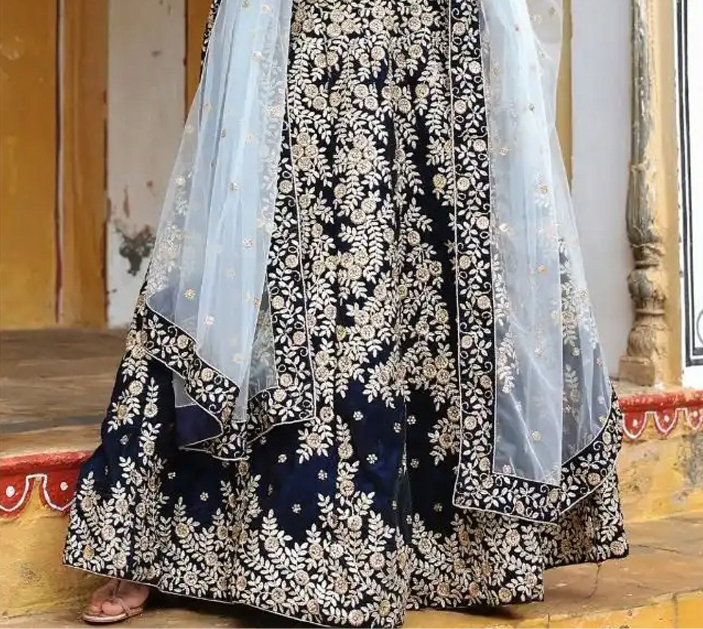 Silk and satin lehenga choli with detailed embroidery surface