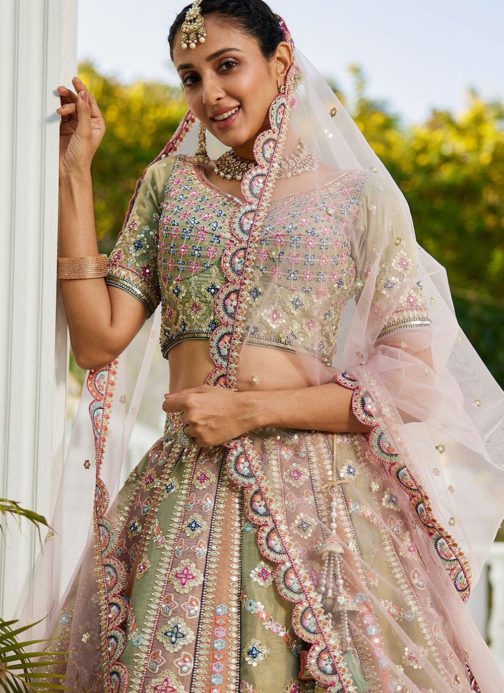 mirror work close-up on off-white lehenga choli design
