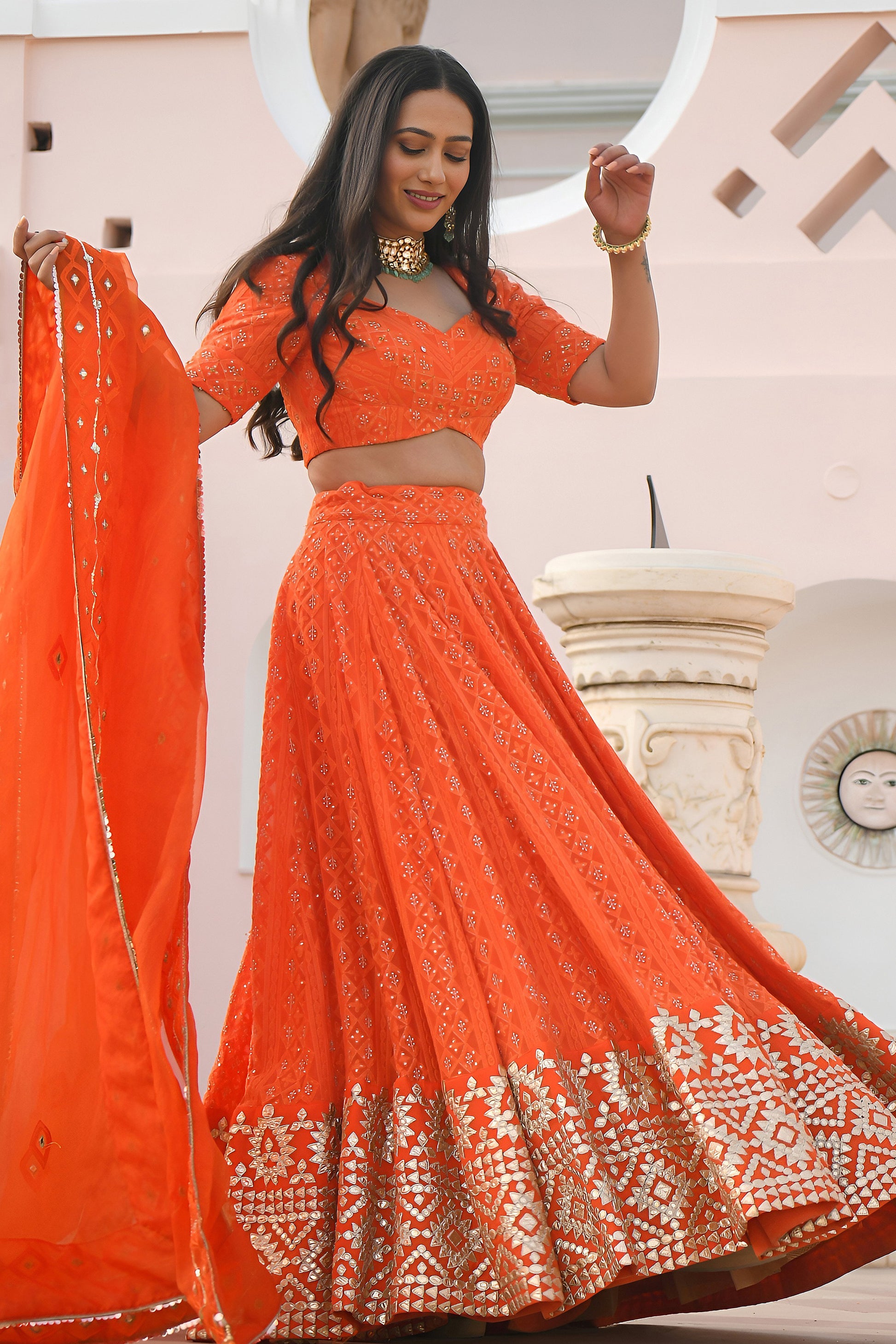 Orange lehenga set with sequins and thread embroidery