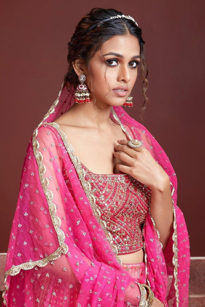 close up of sequins work on pink lehenga skirt