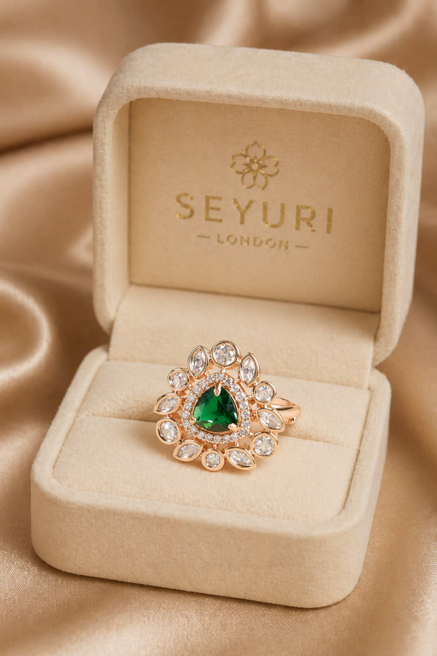 premium emerald ring in luxury box packaging